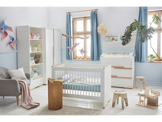 Complete bedroom set including baby cot, changing table, and wardrobe by Doucezen in white and wood.